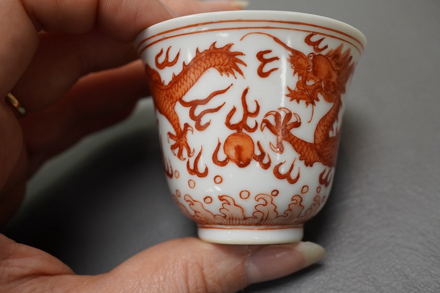 A pair of Chinese iron red ‘dragon’ cups, Guangxu six character mark and probably of the period (1875-1908)